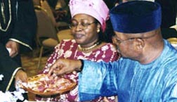 African man collects a kola-nut during an African Event
